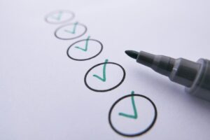 Garage door maintenance checklist items marked off by green marker