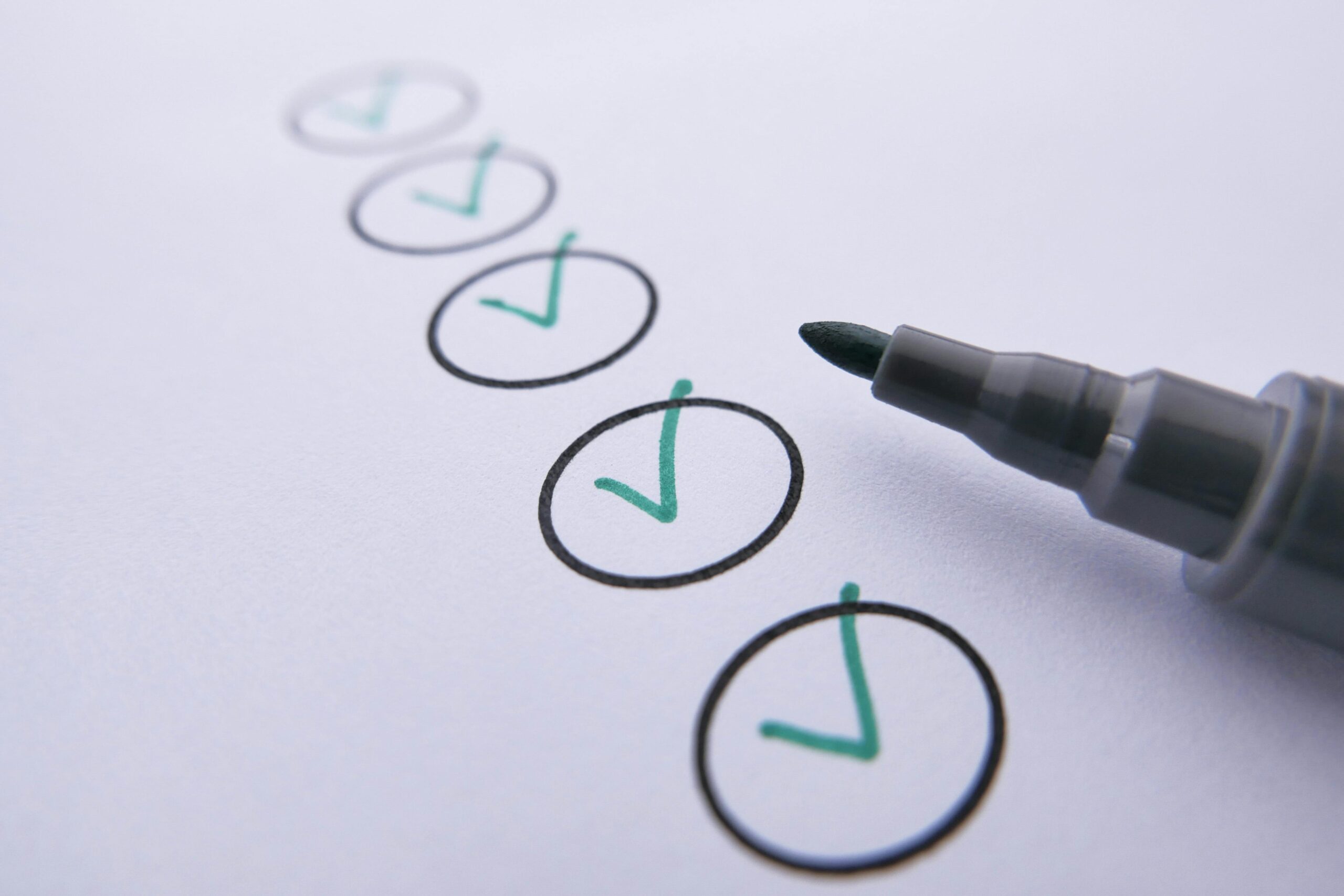 Garage door maintenance checklist items marked off by green marker